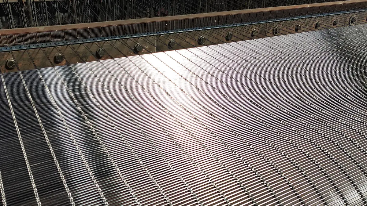 Architectural metal mesh production line showing supplier manufacturing capability