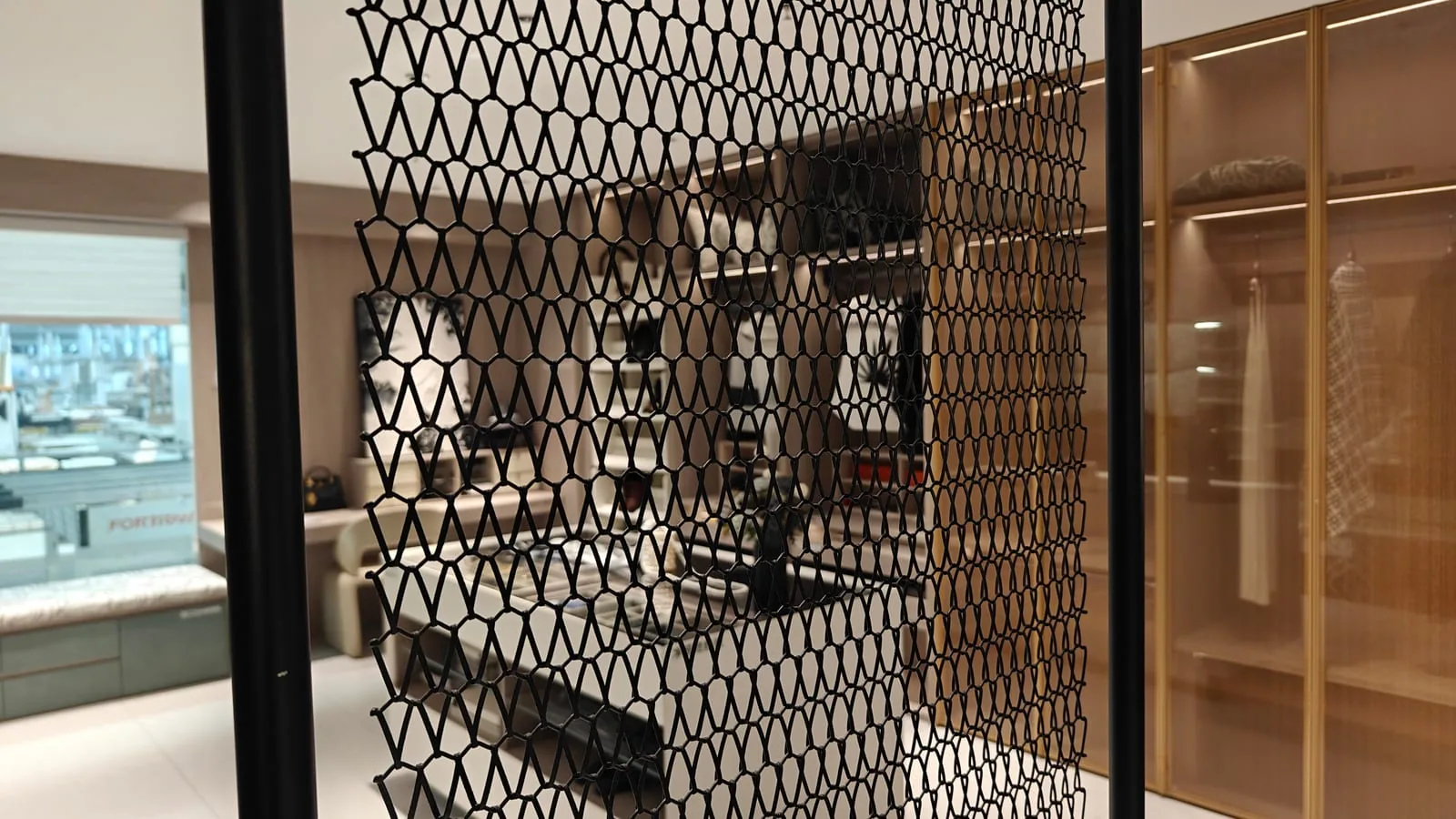 Suspended architectural spiral mesh support route