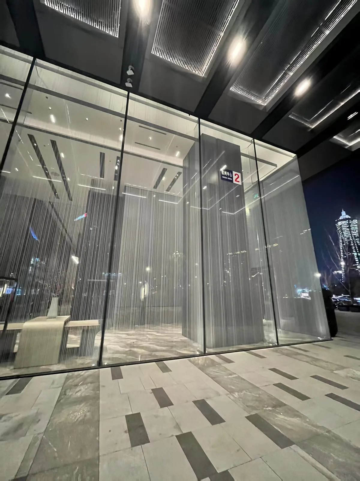 Built-in metal mesh surface detail with glass and interior layers